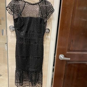 Black open back knee length dress